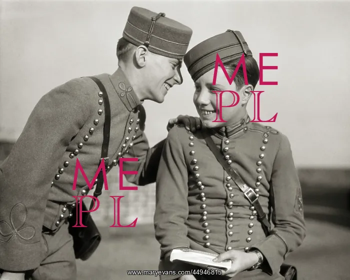 : Two Smiling Hotel Bellhops in Uniform Sharing : Two Smiling Hotel Bellhops in Uniform Sharing