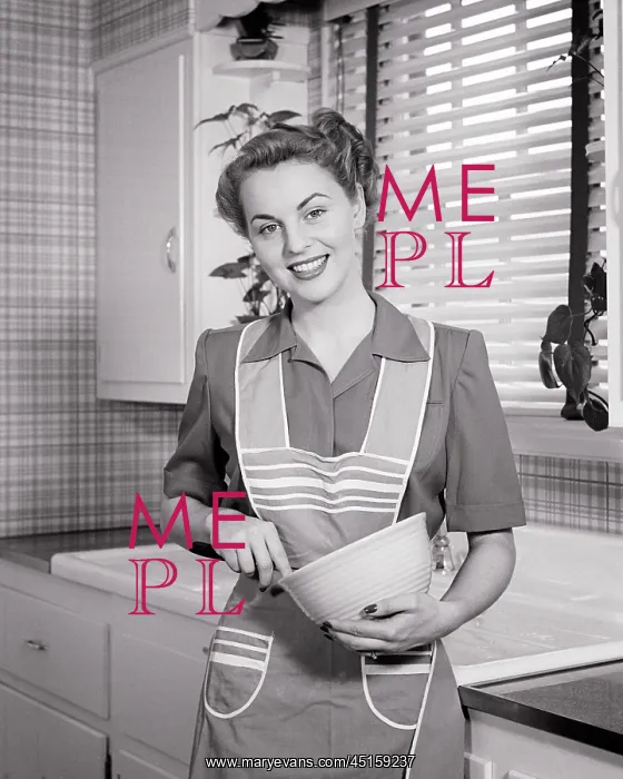  : Smiling Housewife in Kitchen Looking at Camera