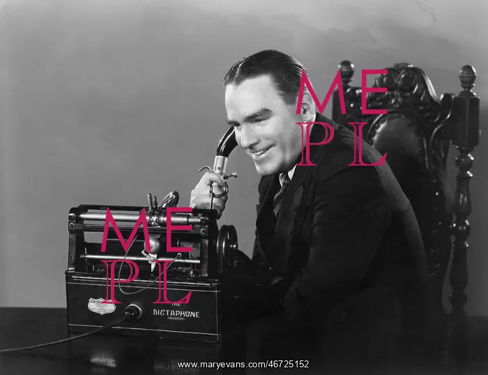: Smiling man using Dictaphone : Smiling man using Dictaphone