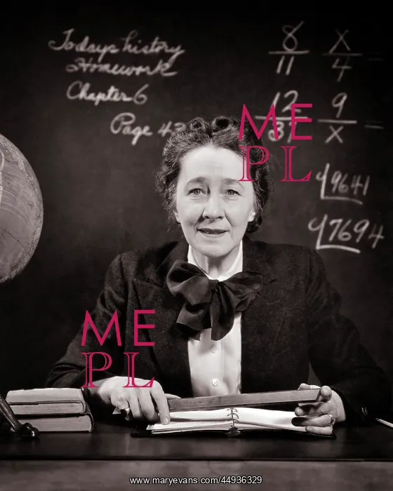 : Smiling Middle Aged School Teacher at Desk Beside Globe : Smiling Middle Aged School Teacher at Desk Beside Globe
