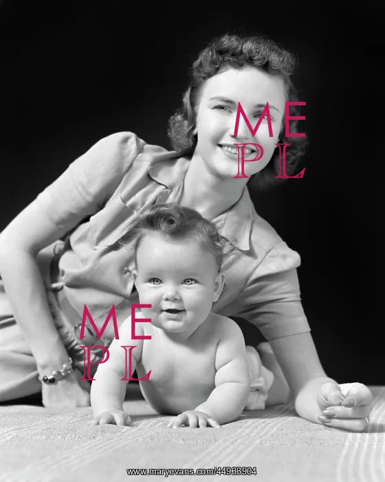 : Smiling Mother and Baby Lying on Elbows looking at Camera : Smiling Mother and Baby Lying on Elbows looking at Camera