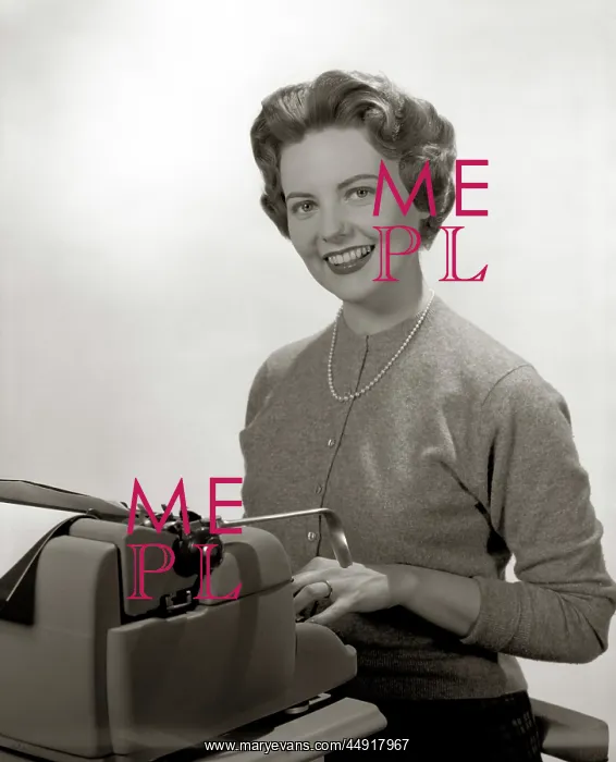 : Smiling portrait secretary seated behind typewriter : Smiling portrait secretary seated behind typewriter
