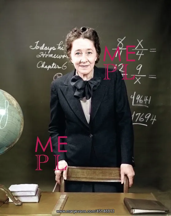 : Smiling School Teacher Standing Behind Her Desk : Smiling School Teacher Standing Behind Her Desk