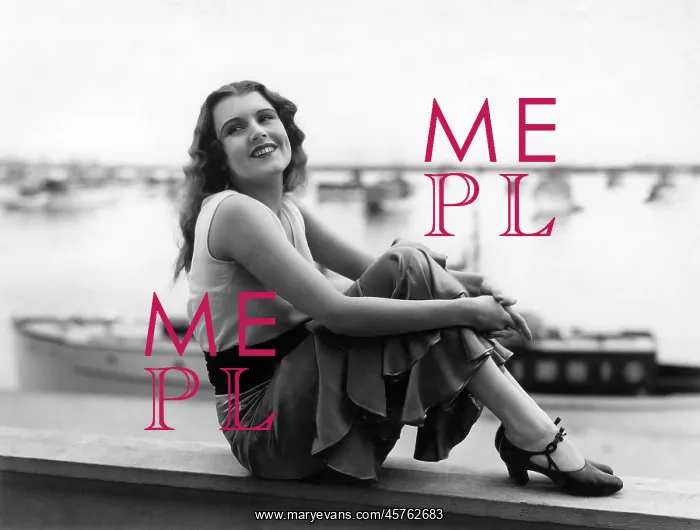 : Smiling woman posing by sea : Smiling woman posing by sea