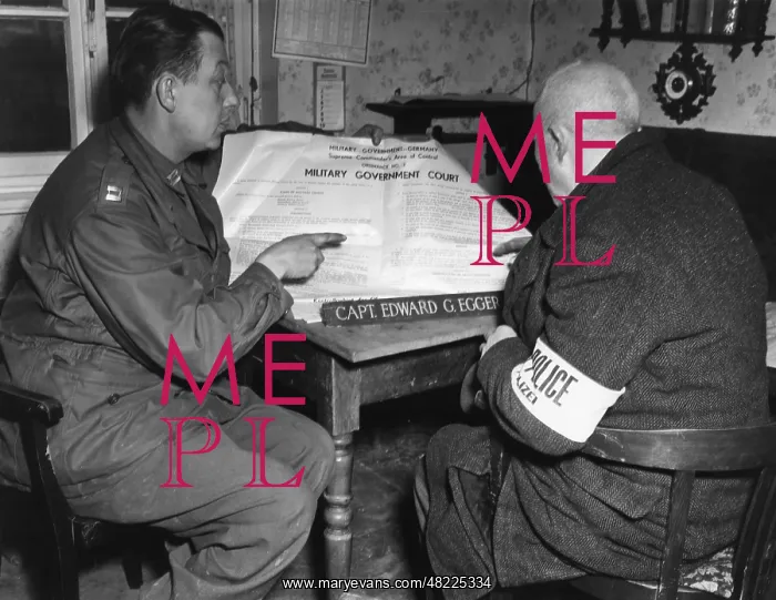 : Soldier of the US Army instructing a policeman, 1945 : Soldier of the US Army instructing a policeman, 1945