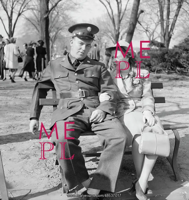 : Soldier and friend sit on a park bench in : Soldier and friend sit on a park bench in