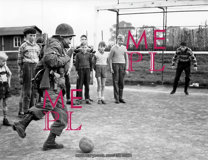 : US soldier plays soccer : US soldier plays soccer
