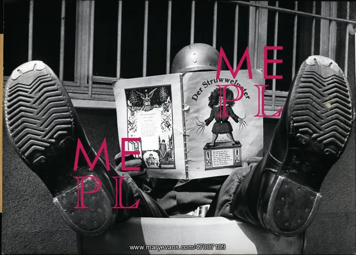 : Soldier reads Der Struwwelpeter, famous children's book : Soldier reads Der Struwwelpeter, famous children's book