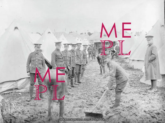 : Soldiers cleaning up at a muddy training camp : Soldiers cleaning up at a muddy training camp