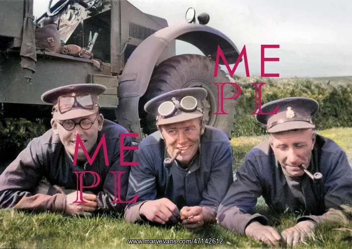 : Three soldiers lying on the grass by their jeep : Three soldiers lying on the grass by their jeep