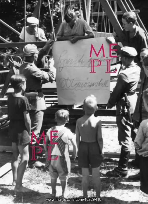  : Soldiers mount a poster, 1935