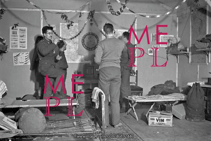  : Four soldiers playing darts in an army hut