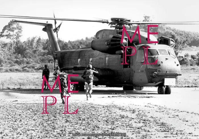 : Soldiers run to a HH-53C helicopter during : Soldiers run to a HH-53C helicopter during