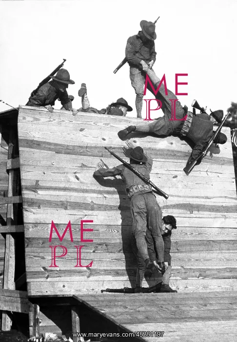 : Soldiers scaling a wall during basic training : Soldiers scaling a wall during basic training
