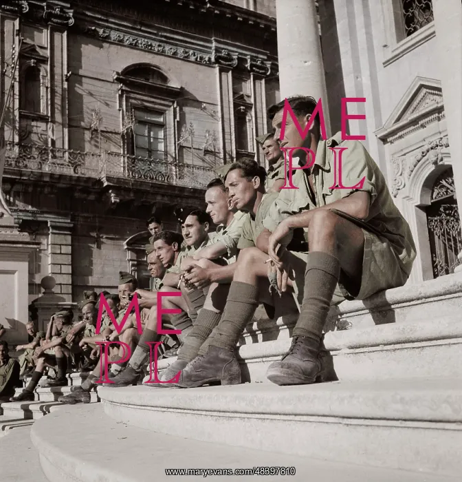 : Soldiers sitting on the steps of a cathedral : Soldiers sitting on the steps of a cathedral