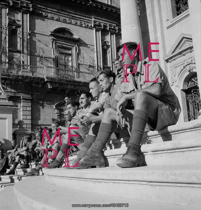 : Soldiers sitting on the steps of a cathedral : Soldiers sitting on the steps of a cathedral