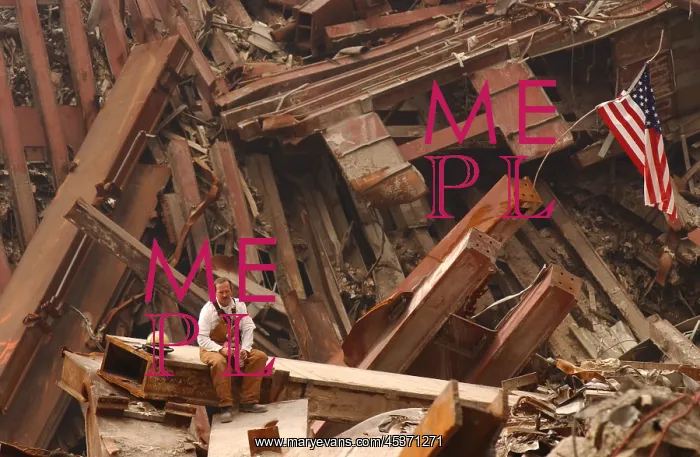 : Solo firefighter sitting on a beam in the wreckage : Solo firefighter sitting on a beam in the wreckage
