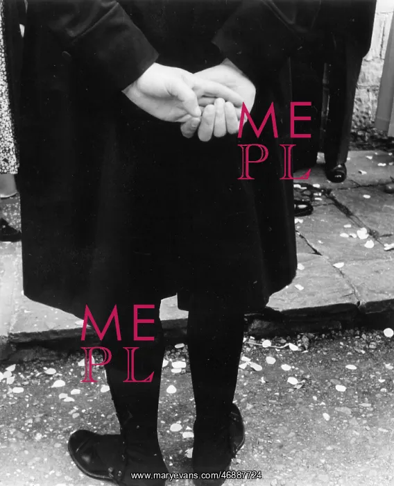 : Spectator at a wedding, with confetti on the ground : Spectator at a wedding, with confetti on the ground