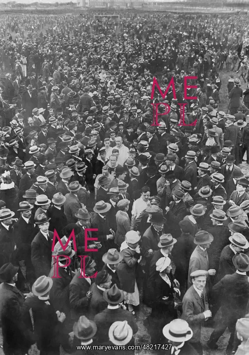 : Spectators on the lawn after a soccer match, 1920 : Spectators on the lawn after a soccer match, 1920