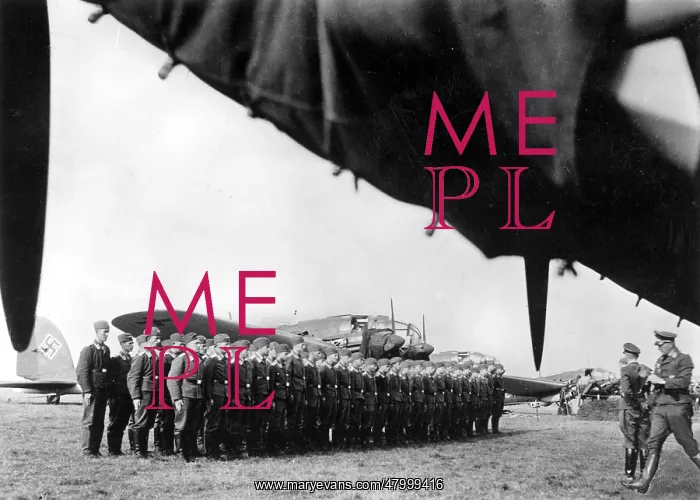 : A squadron crew of a bomber wing has lined up to muster : A squadron crew of a bomber wing has lined up to muster