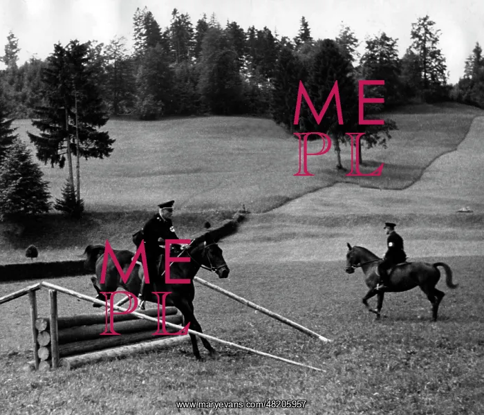: SS men practising show jumping : SS men practising show jumping