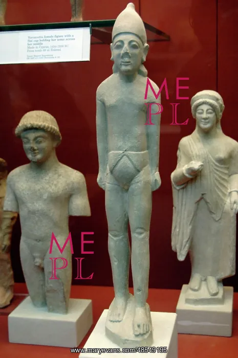 : Statue of a man wearing a pointed cap or helmet and a cyprio : Statue of a man wearing a pointed cap or helmet and a cyprio