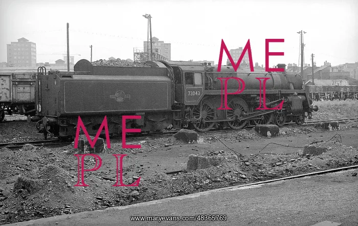 : Steam engine over ashpit at Nine Elms Loco Yard : Steam engine over ashpit at Nine Elms Loco Yard