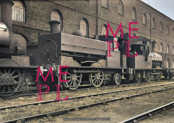 : Steam engine at side of building : Steam engine at side of building