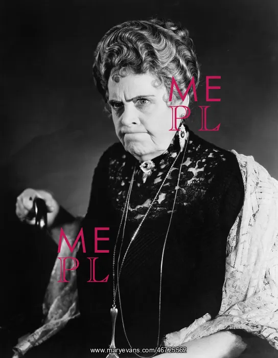: A very stern looking woman holding onto her cane : A very stern looking woman holding onto her cane