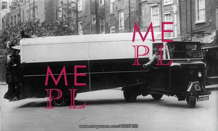 : A streamlined garbage truck in London : A streamlined garbage truck in London