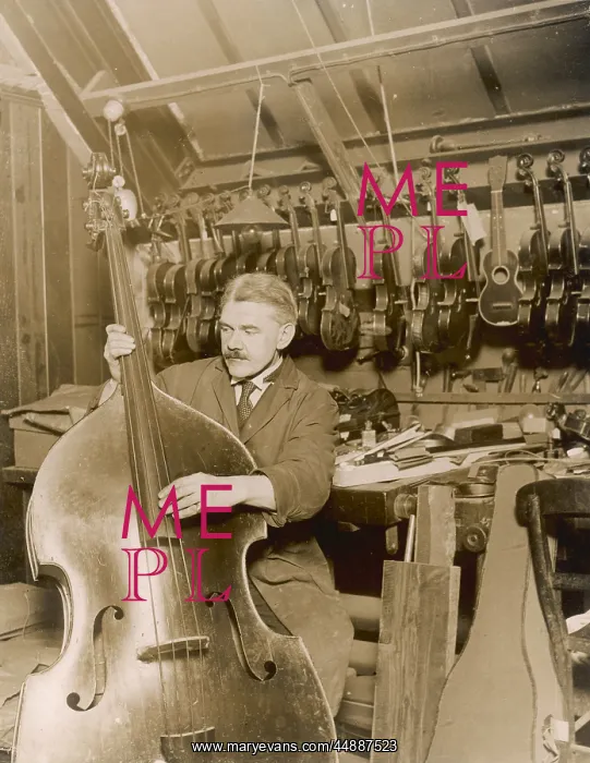 : Stringed instrument maker in his workshop : Stringed instrument maker in his workshop