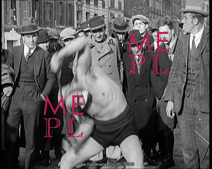 : A Strongman Bending An Iron Bar Around His Head : A Strongman Bending An Iron Bar Around His Head