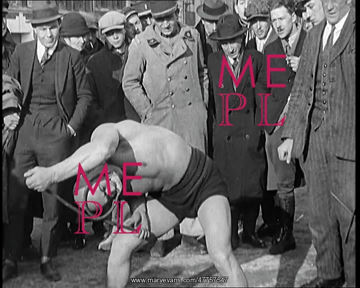 : A Strongman Bending An Iron Bar Around His Head : A Strongman Bending An Iron Bar Around His Head