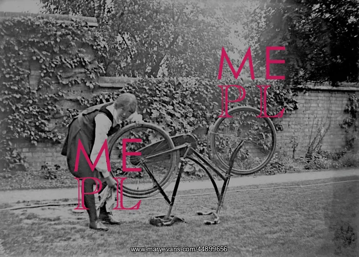  : Student cleaning bicycle