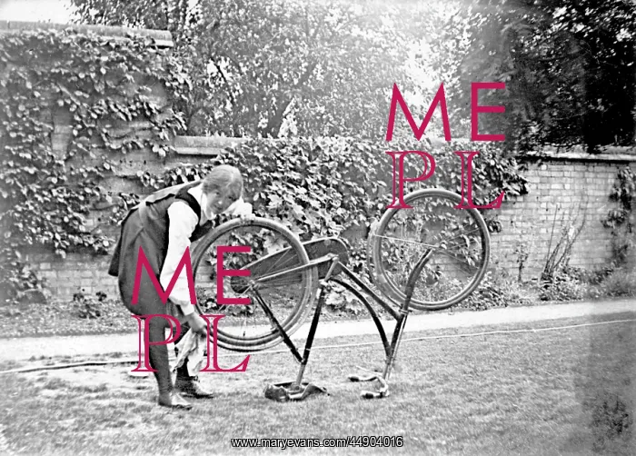  : Student cleaning bicycle