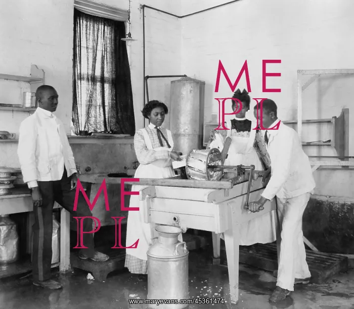 : Students operating a small cotton gin at the Tuskegee : Students operating a small cotton gin at the Tuskegee