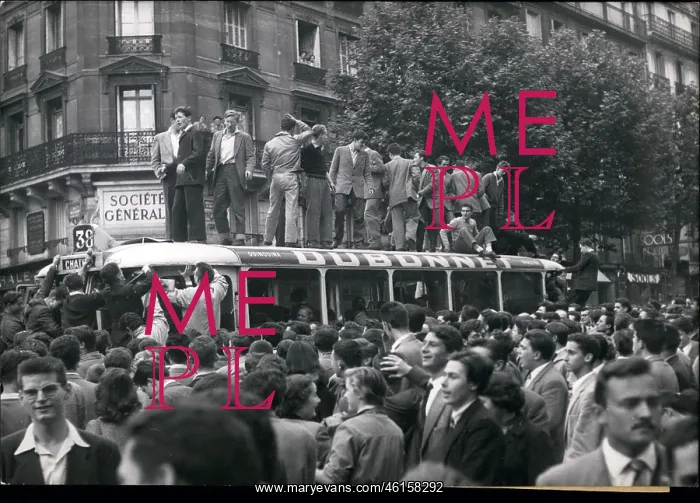 : Students stand on top of bus in Latin Quarter of Paris : Students stand on top of bus in Latin Quarter of Paris
