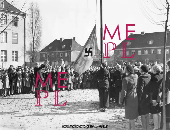 : Students and teachers take down the swastika flag, 1939 : Students and teachers take down the swastika flag, 1939