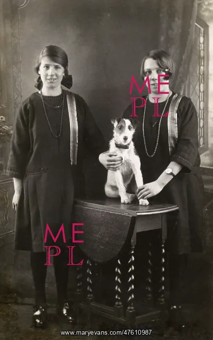 : Studio portrait, two girls with terrier : Studio portrait, two girls with terrier