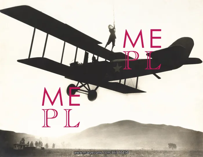 : Stunt woman standing on top of biplane : Stunt woman standing on top of biplane