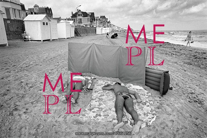 : Sunbathers on the beach at Langrune Sur Mar, Normandy : Sunbathers on the beach at Langrune Sur Mar, Normandy