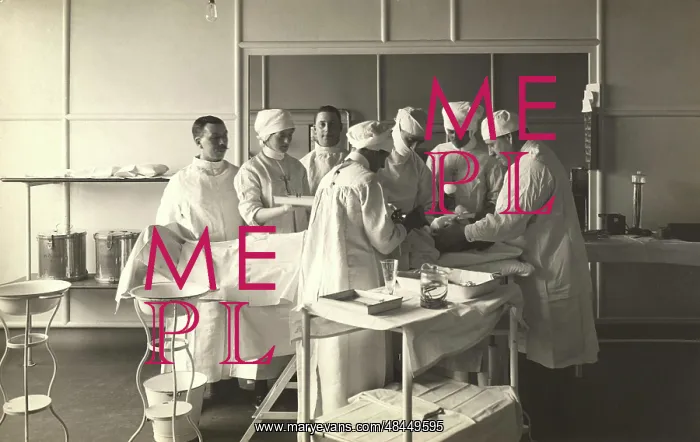 : Surgeons and nurses tending to a patient at : Surgeons and nurses tending to a patient at