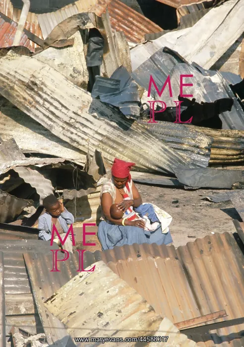 : Surrounded by the burnt remains of her and others : Surrounded by the burnt remains of her and others