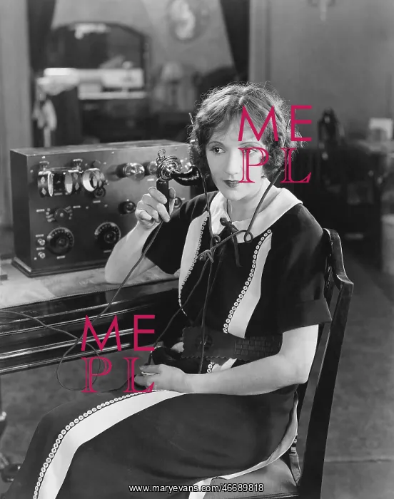 : Switchboard operator sitting at telephone switchboard : Switchboard operator sitting at telephone switchboard