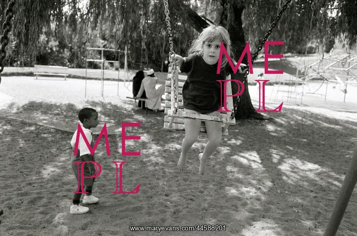  : Tabitha, Ken Oosterbroek's daughter playing on a swing