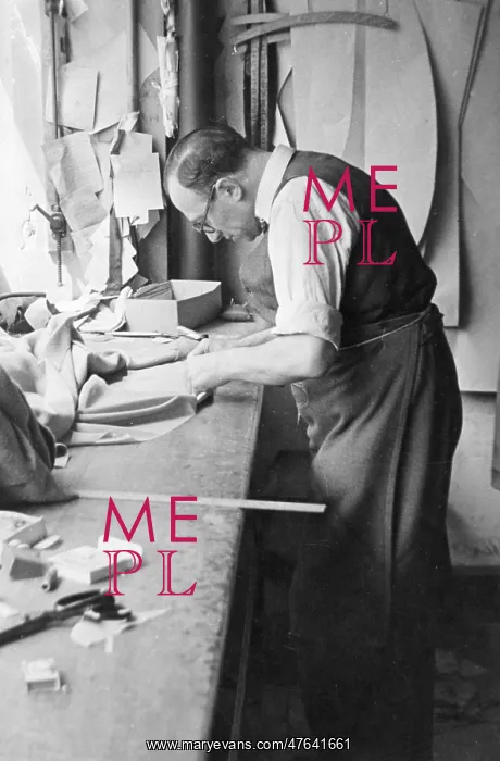 : Tailor at work on a garment