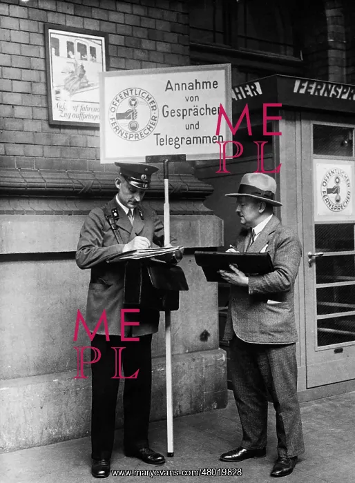  : Taking up travel calls on the station platform, 1931