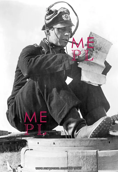 : Tank commander studying maps : Tank commander studying maps