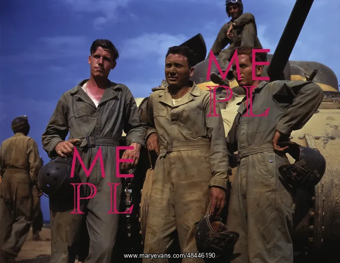 : Tank crew standing in front of an M4 tank : Tank crew standing in front of an M4 tank