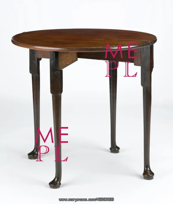 : Tea table. Mahogany tea table with a folding half-round top, on turned : Tea table. Mahogany tea table with a folding half-round top, on turned